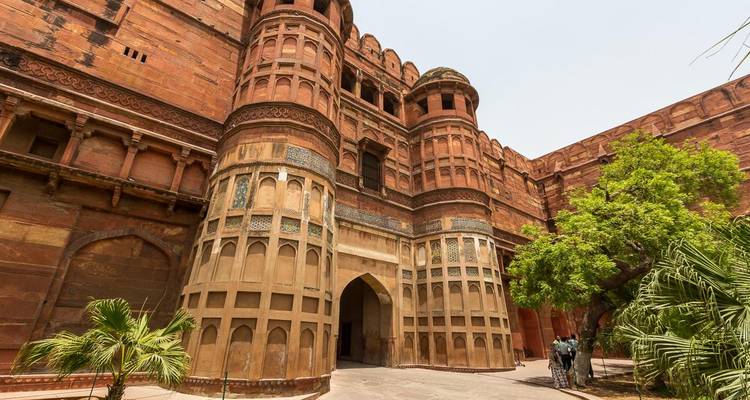Agra Fort with intricate architecture and greenery.
