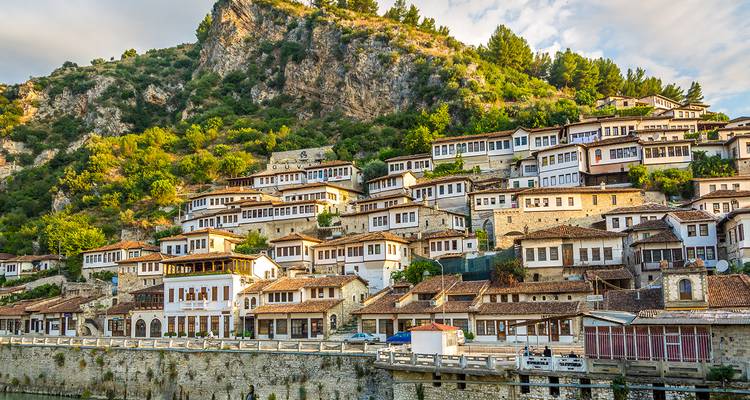 Historical town with traditional hillside architecture in Albania.