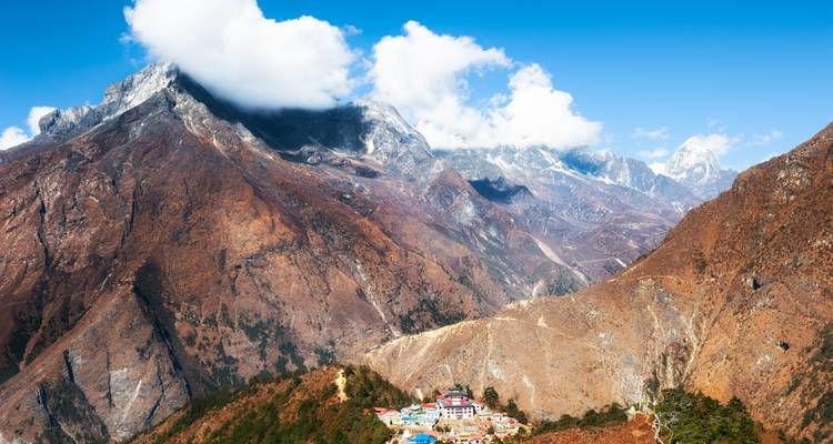 Vast Himalayan panorama with remote monastery settlement nestled on a ridge