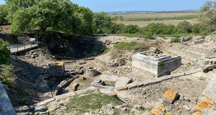 Archaeological site with ancient stone structures.