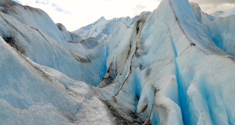 Close view of the icy peaks and crevices of a glacier.