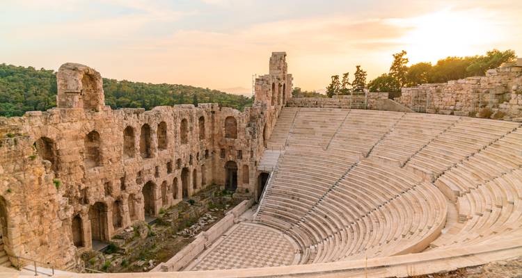 Ancient amphitheater in Athens with sunset.