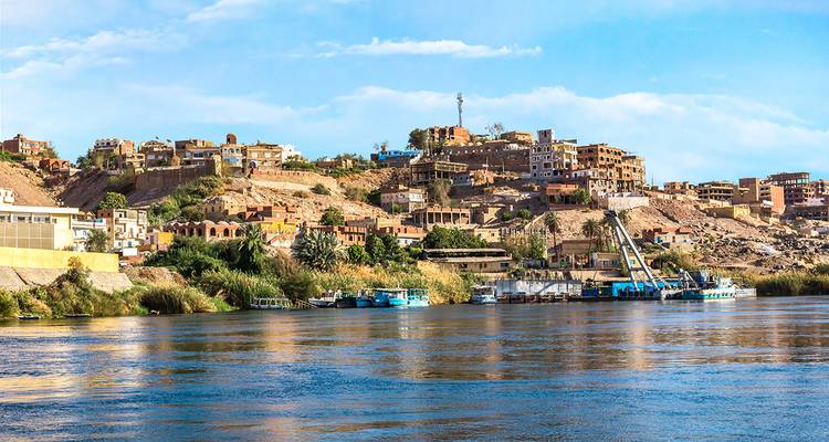 View across the Nile River to a hillside community in Aswan.