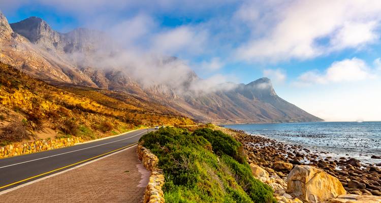 Coastal road with mountains and ocean view