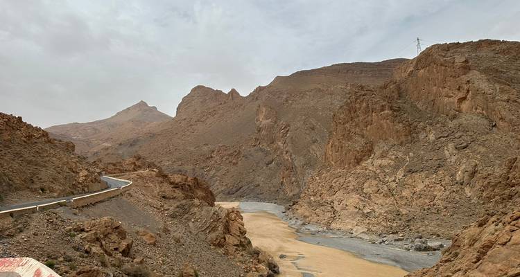 A rocky landscape with rugged formations and an overcast sky.