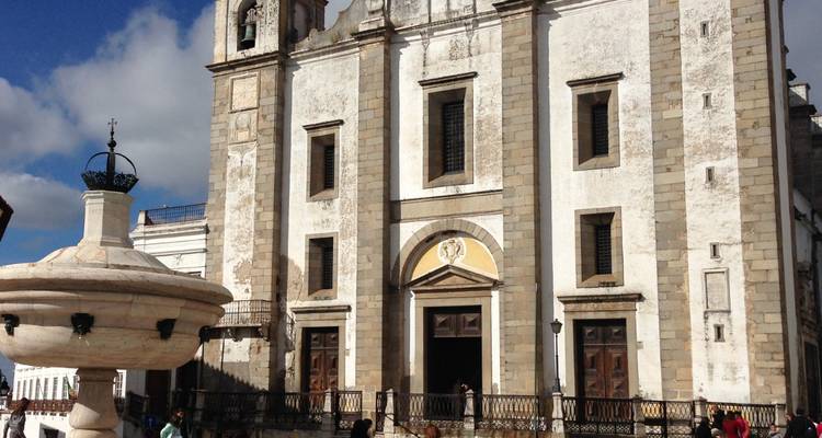 Historic church facade with bright skies.