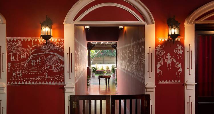 Traditional entrance with decorative wall art and warm lighting.