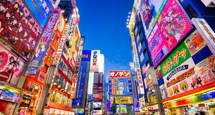 Vibrant cityscape of Akihabara with neon signs.