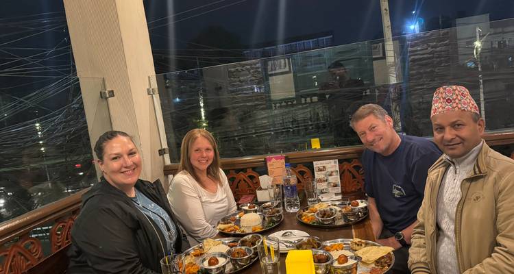 Group dining at a restaurant with traditional food.