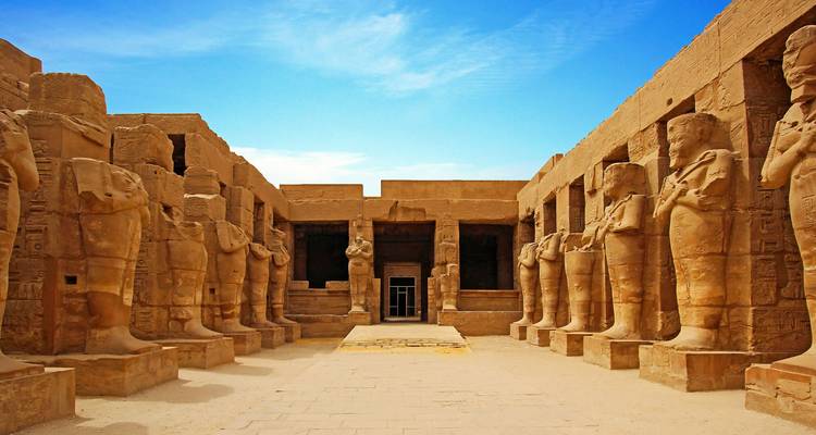 Ancient Egyptian temple ruins with stone columns.