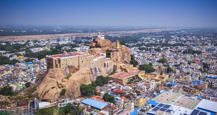 Aerial view showing a large fort on a rocky hill.