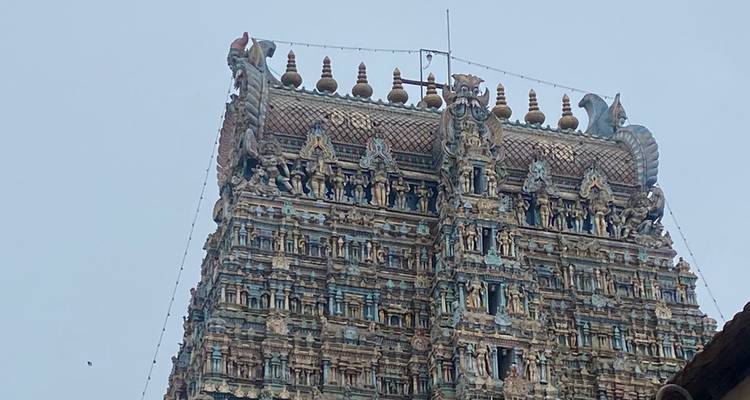 Close-up of a temple tower with intricate carvings.