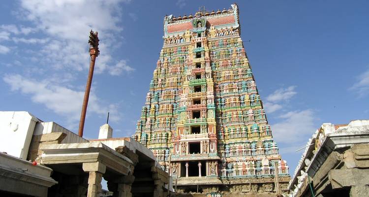 Temple gopuram under a clear blue sky.