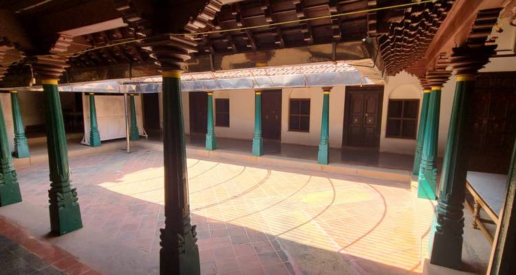 Courtyard of a traditional house with sunlight filtering through.