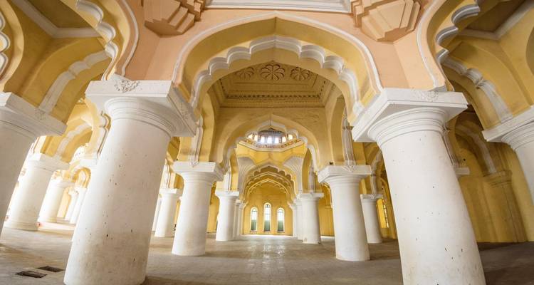 Palatial hall with arches and decorative ceilings.