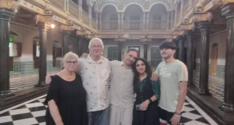 Families inside a historic building with intricate details.