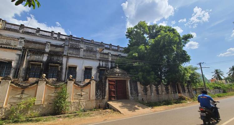 Old building with intricate details, viewed from the road.