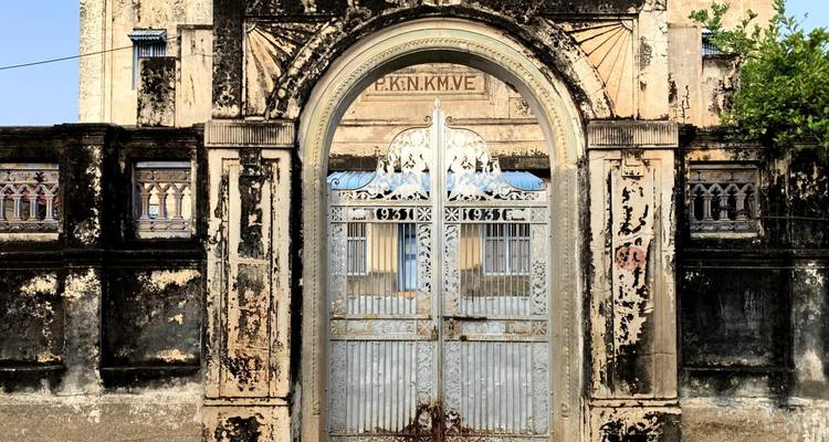 Ornate gate of an old building with intricate details.