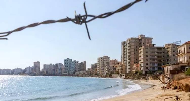 Beachfront with abandoned high-rise buildings.