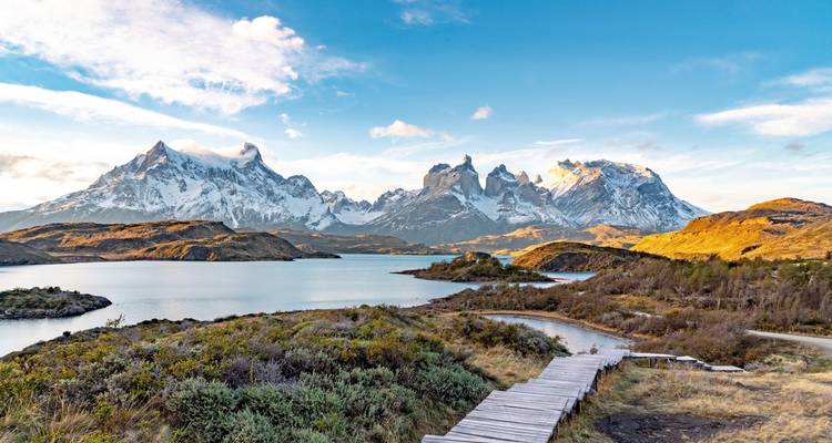 Beautiful mountain range by a lake under a clear sky.
