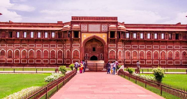 Entrance of Agra Fort with people.