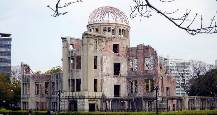 Ruins of Peace Memorial with surrounding urban landscape.