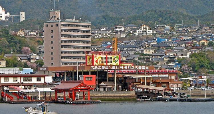 Cityscape view with buildings and a torii gate.