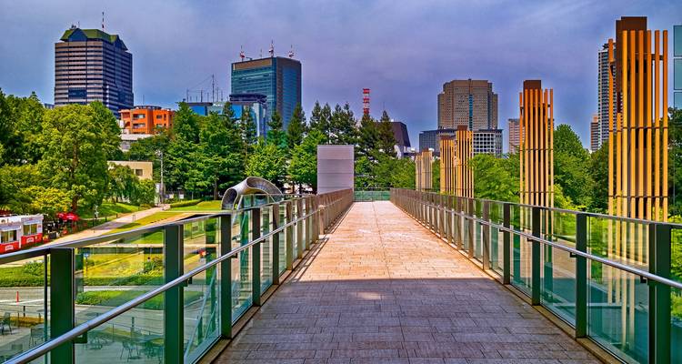 Modern walkway with city buildings around.