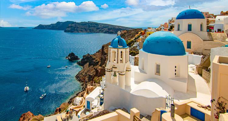 Famous blue-domed churches overlooking the sea.