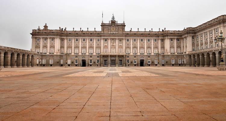 The courtyard of the Royal Palace in Madrid on an overcast day.