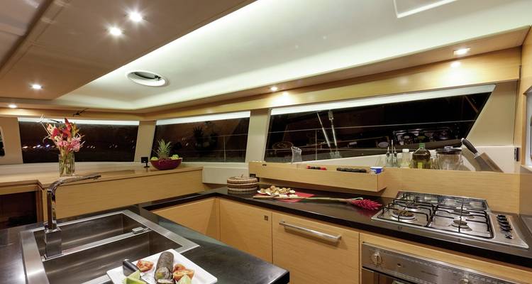Modern yacht kitchen interior with cookware.