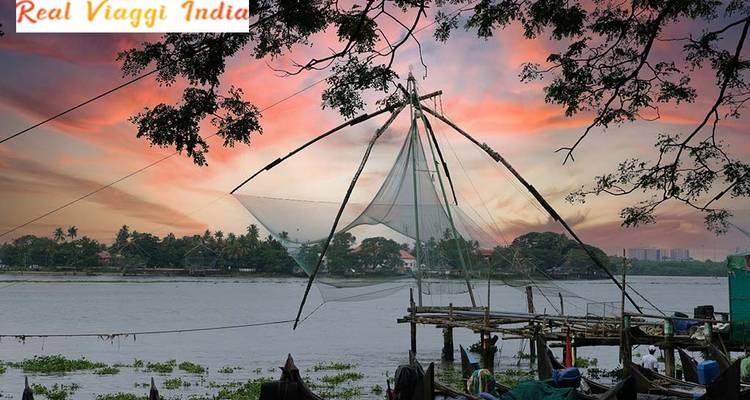 Chinese fishing nets by the water during sunset.