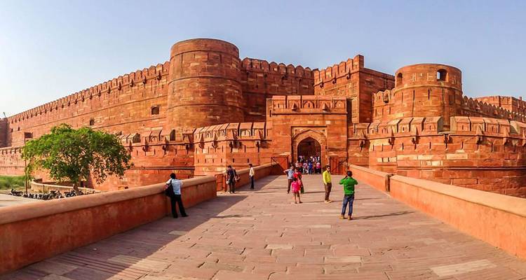 Agra Fort with tourists in the foreground.