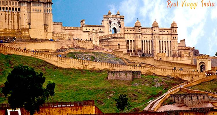 Historic fortification atop a hill with rugged terrain.