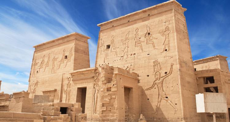 A view of the Temple of Philae under a bright sky.