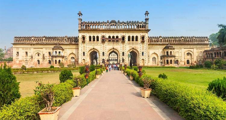 Ornate gateway with people walking towards it.