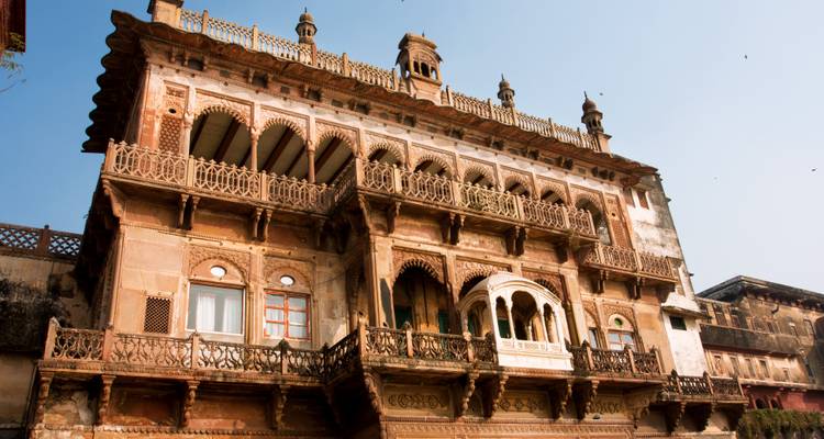 Historic building with intricate carvings and balconies.