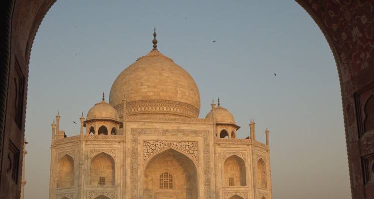 View of the Taj Mahal through an archway.