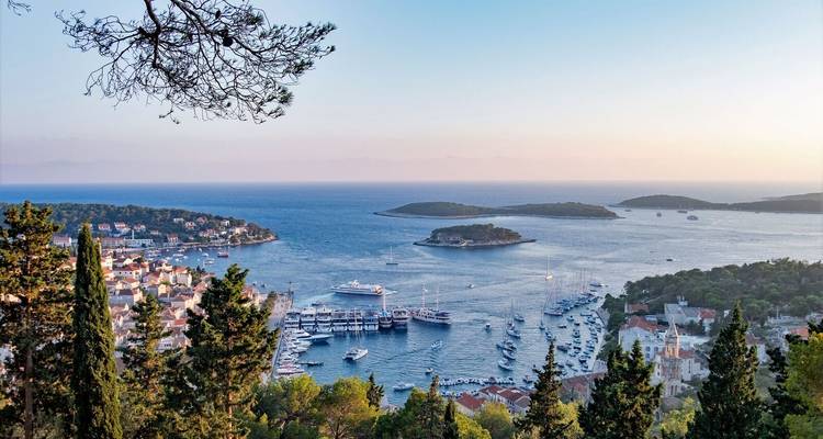 Island view with yachts and boats surrounded by the sea.