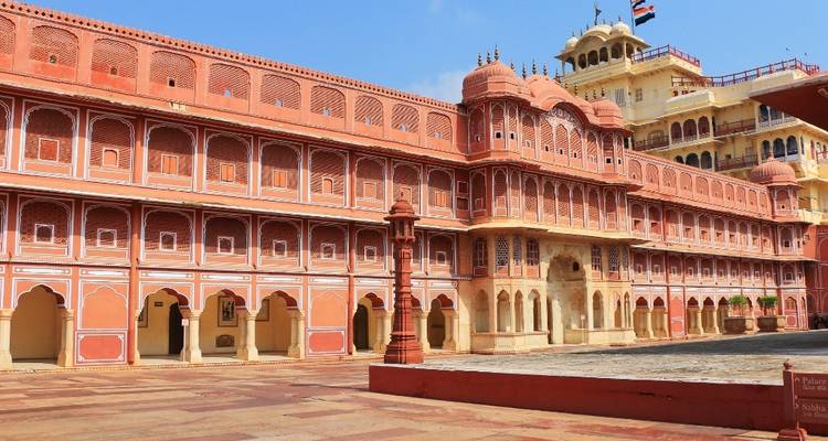 Large red and yellow palace with courtyards.