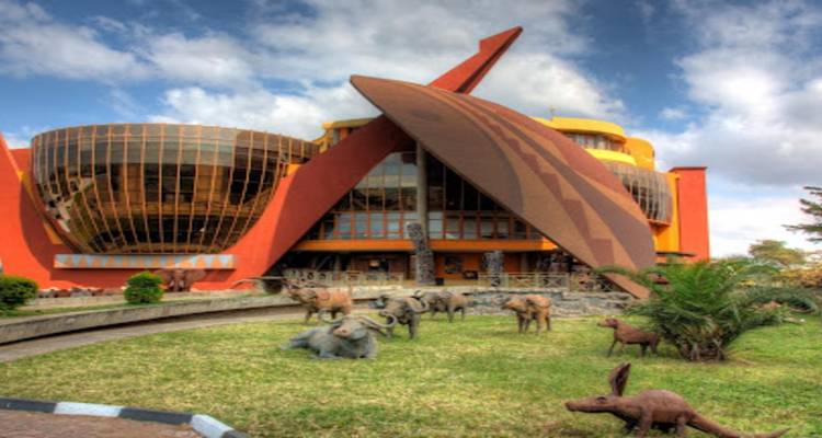 Contemporary building with African wildlife sculptures in front.