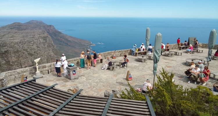 A scenic view from a lookout point with people enjoying the view.