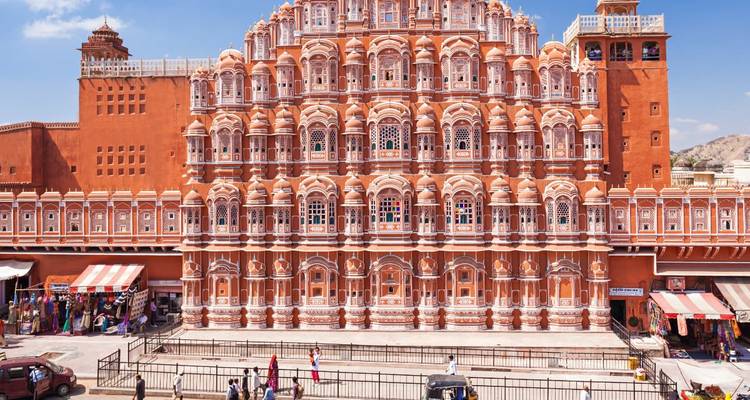 The stunning facade of Hawa Mahal with small shops at the front.