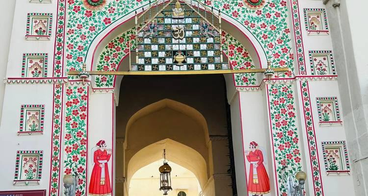 Ornate decorated gate with intricate floral designs.