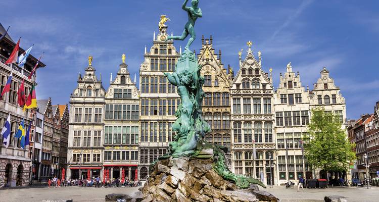 Historic city square with ornate buildings and statues.