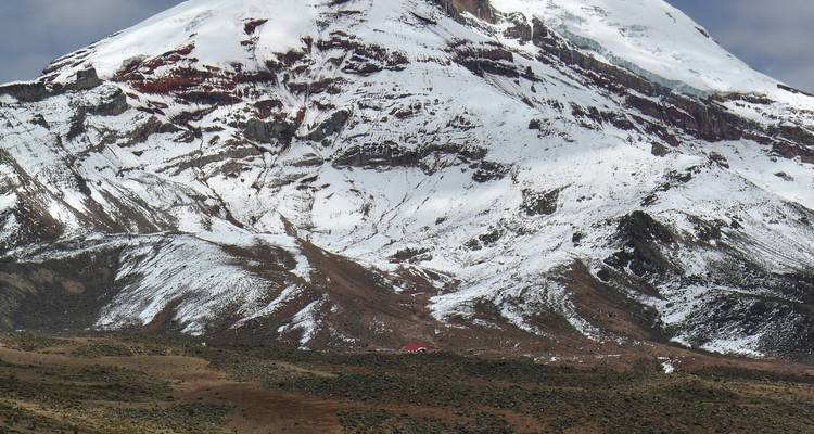 Snow-covered peak of a volcanic mountain.