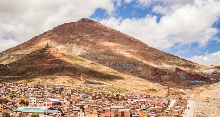 A city located at the base of a large, mineral-rich mountain.