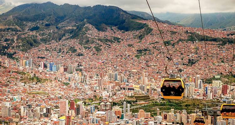 A vast cityscape with cable cars running over the city.