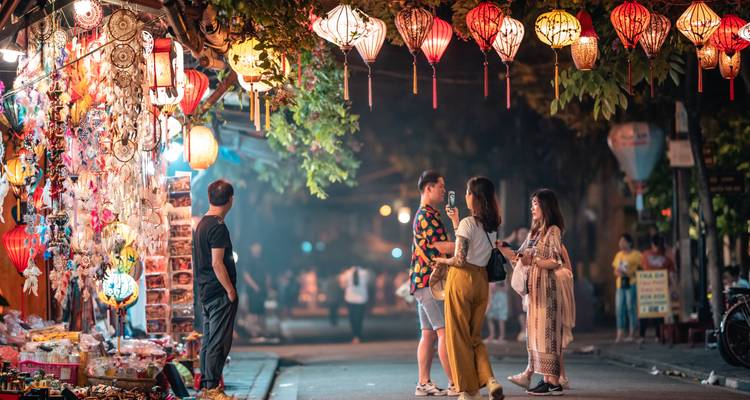 Night market scene with colorful lanterns.