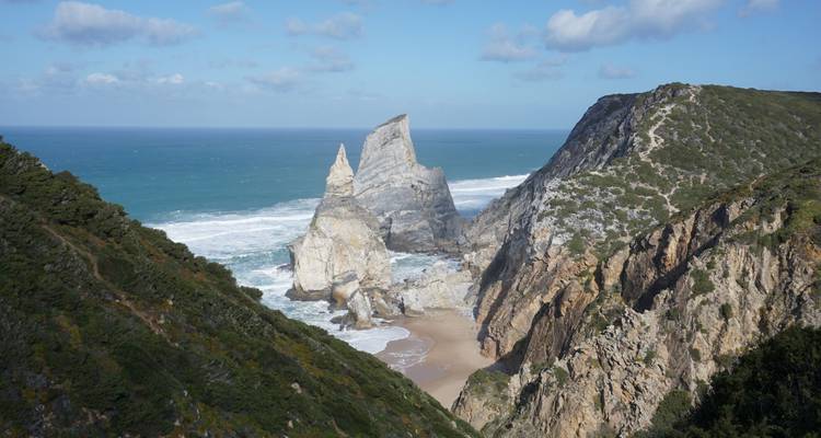Dramatic rock formations near a secluded beach